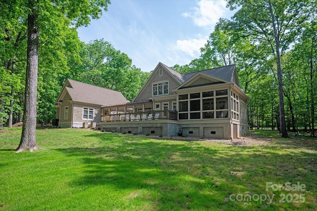 3408 Sandalwood Ln, Waxhaw, NC 28173 - rear view of property featuring a sunroom, a lawn, and a wooden deck