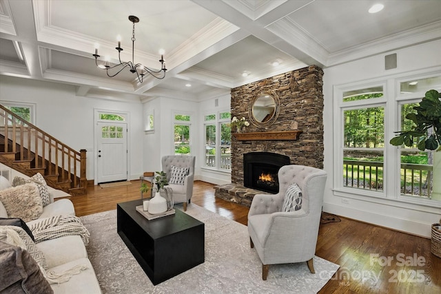 3408 Sandalwood Ln, Waxhaw, NC 28173 - living room with coffered ceiling, a fireplace, a chandelier, stairs, and wood finished floors