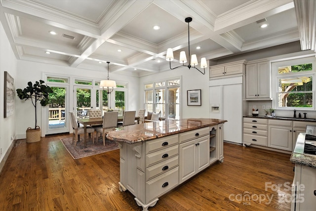 3408 Sandalwood Ln, Waxhaw, NC 28173 - kitchen with paneled built in fridge, coffered ceiling, a kitchen island, french doors, and beam ceiling