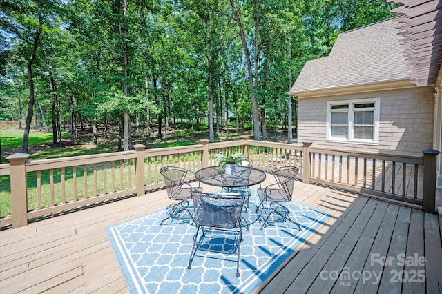 3408 Sandalwood Ln, Waxhaw, NC 28173 - wooden terrace featuring outdoor dining area and view of wooded area