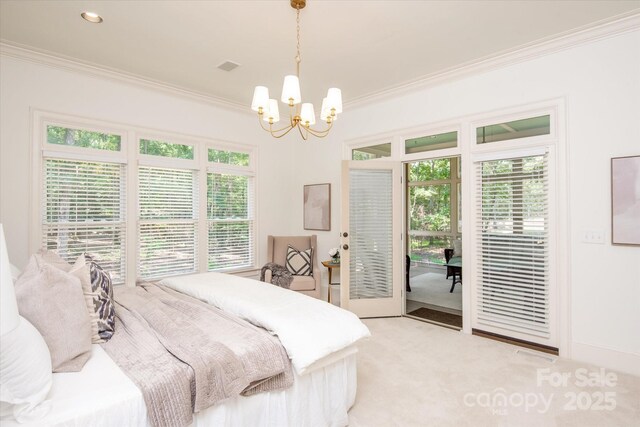 3408 Sandalwood Ln, Waxhaw, NC 28173 - bedroom with access to exterior, crown molding, a chandelier, multiple windows, and light carpet
