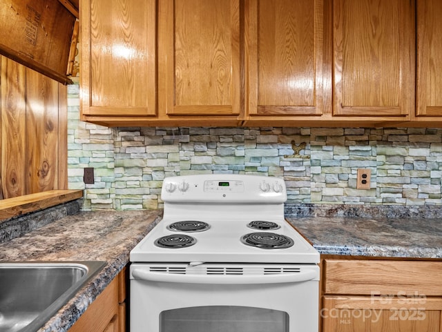 70 John Delk Rd, Hendersonville, NC 28792 - kitchen with white electric stove, decorative backsplash, dark countertops, and brown cabinetry