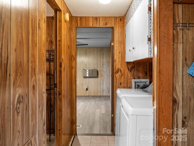 70 John Delk Rd, Hendersonville, NC 28792 - laundry area with cabinet space, separate washer and dryer, and wooden walls