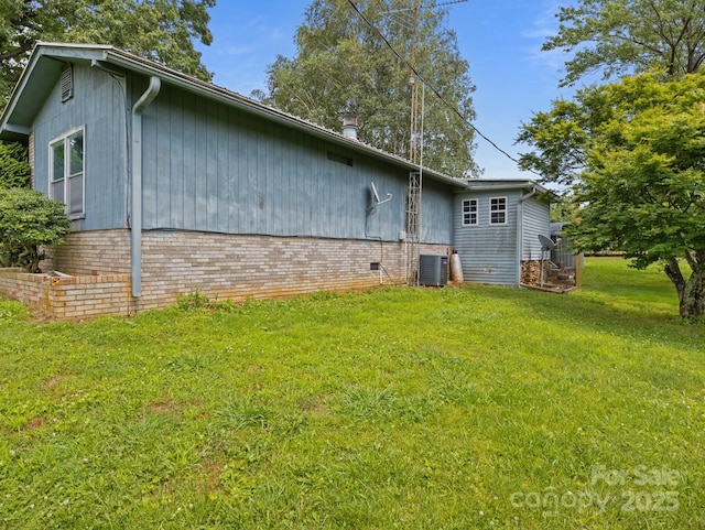 70 John Delk Rd, Hendersonville, NC 28792 - rear view of property featuring a lawn and brick siding
