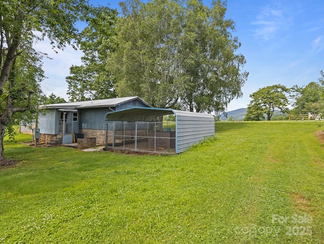 70 John Delk Rd, Hendersonville, NC 28792 - view of grassy yard featuring a detached carport
