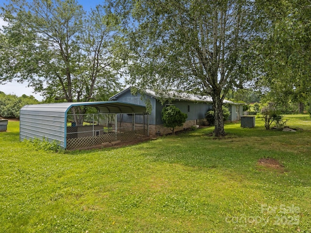 70 John Delk Rd, Hendersonville, NC 28792 - view of green lawn with a detached carport