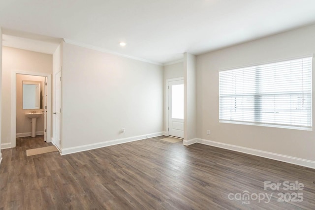 116 Kennford Trl, Troutman, NC 28166 - unfurnished room with dark wood finished floors, ornamental molding, and recessed lighting
