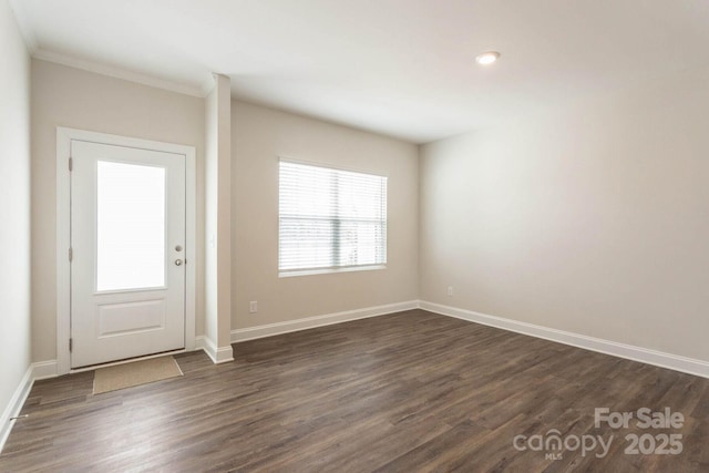 116 Kennford Trl, Troutman, NC 28166 - foyer with dark wood finished floors, ornamental molding, and recessed lighting