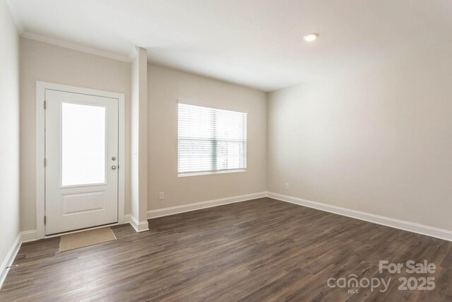 116 Kennford Trl, Troutman, NC 28166 - foyer with dark wood finished floors, ornamental molding, and recessed lighting