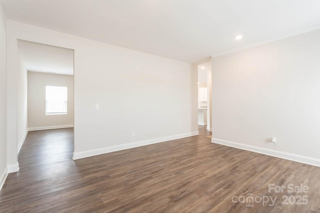 116 Kennford Trl, Troutman, NC 28166 - empty room with dark wood finished floors and recessed lighting