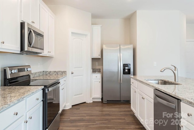 116 Kennford Trl, Troutman, NC 28166 - kitchen featuring stainless steel appliances, white cabinets, dark wood-type flooring, and light stone countertops