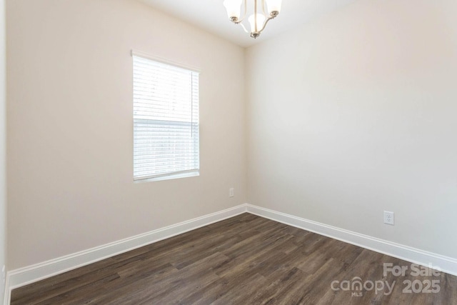 116 Kennford Trl, Troutman, NC 28166 - empty room with dark wood-style floors and a chandelier