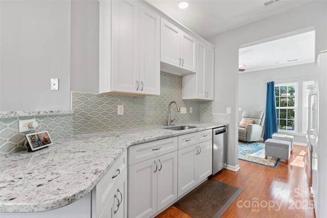 4103 Christine Ln Unit E, Waxhaw, NC 28173 - kitchen featuring dishwasher, white refrigerator, white cabinets, wood finished floors, and tasteful backsplash