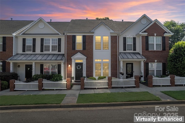 4103 Christine Ln Unit E, Waxhaw, NC 28173 - view of property with a standing seam roof and a fenced front yard