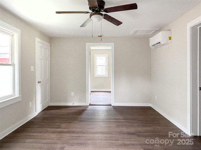 33 Graybark Ct, Waynesville, NC 28786 - unfurnished room featuring a wall unit AC, wood finished floors, and a ceiling fan