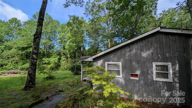 242 Upper Whitewater Rd, Sapphire, NC 28774 - view of property exterior with board and batten siding