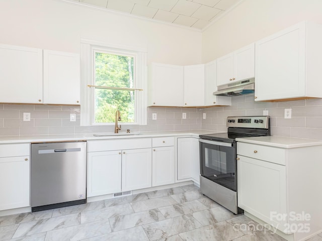 110 College St, Marshville, NC 28103 - kitchen with stainless steel appliances, under cabinet range hood, crown molding, light countertops, and white cabinets