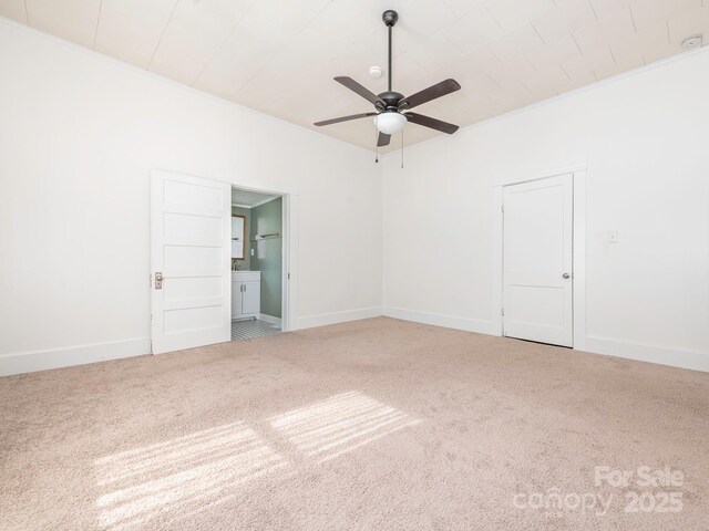 110 College St, Marshville, NC 28103 - carpeted empty room with a ceiling fan and ornamental molding