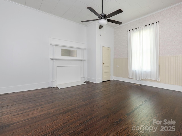 110 College St, Marshville, NC 28103 - unfurnished living room with crown molding, ceiling fan, wallpapered walls, and dark wood-style floors