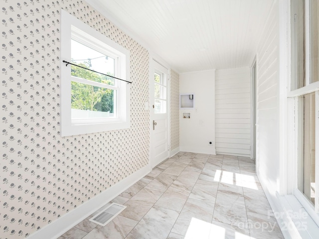 110 College St, Marshville, NC 28103 - unfurnished room with light marble finish flooring and wallpapered walls