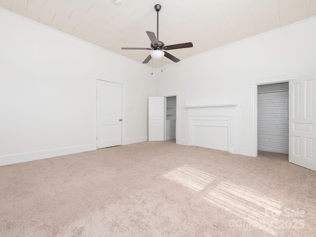 110 College St, Marshville, NC 28103 - unfurnished bedroom featuring carpet, two closets, crown molding, and ceiling fan