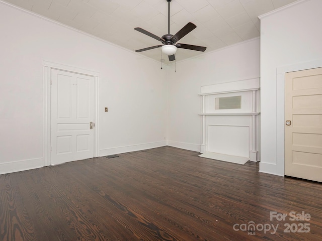 110 College St, Marshville, NC 28103 - spare room with a ceiling fan, ornamental molding, and dark wood-type flooring