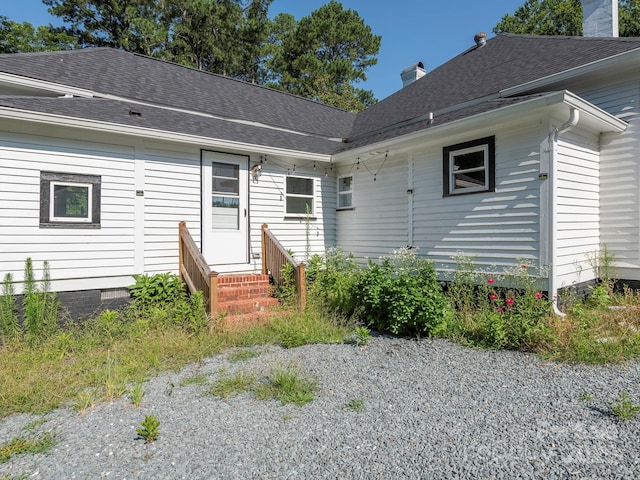 110 College St, Marshville, NC 28103 - view of front of home with a shingled roof and a chimney
