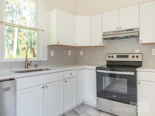 110 College St, Marshville, NC 28103 - kitchen with stainless steel range with electric cooktop, under cabinet range hood, dishwashing machine, light countertops, and white cabinets