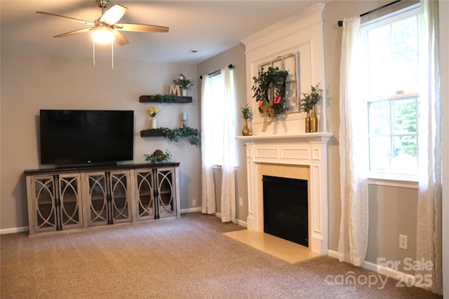 3092 S Legacy Park Blvd, Fort Mill, SC 29707 - carpeted living room with a ceiling fan, a fireplace with flush hearth, and healthy amount of natural light