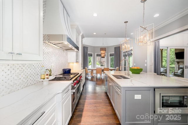 15603 June Washam Rd, Davidson, NC 28036 - kitchen featuring appliances with stainless steel finishes, custom exhaust hood, a chandelier, healthy amount of natural light, and recessed lighting