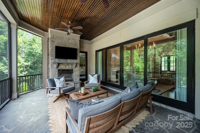 15603 June Washam Rd, Davidson, NC 28036 - view of patio / terrace with an outdoor living space with a fireplace and ceiling fan