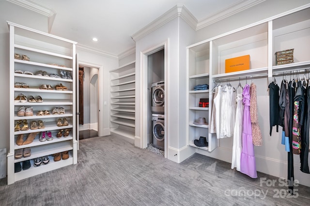15603 June Washam Rd, Davidson, NC 28036 - walk in closet with stacked washer / dryer, arched walkways, and carpet