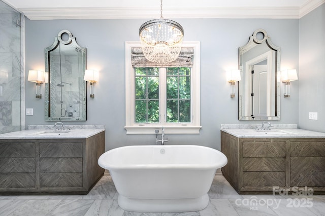 15603 June Washam Rd, Davidson, NC 28036 - bathroom featuring marble look tiles, ornamental molding, a soaking tub, and two vanities