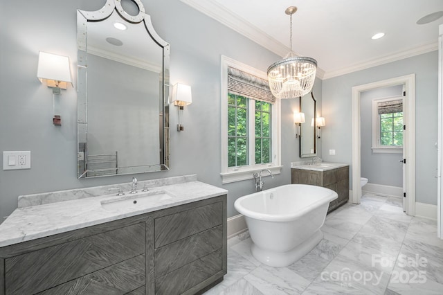 15603 June Washam Rd, Davidson, NC 28036 - bathroom with a freestanding tub, two vanities, crown molding, marble finish flooring, and recessed lighting