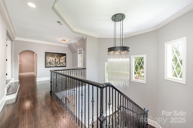 15603 June Washam Rd, Davidson, NC 28036 - hall featuring arched walkways, ornamental molding, wood finished floors, and an upstairs landing