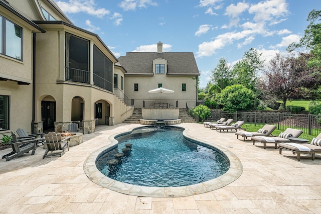 15603 June Washam Rd, Davidson, NC 28036 - view of pool with stairs, a patio area, an outdoor fire pit, and a pool with connected hot tub