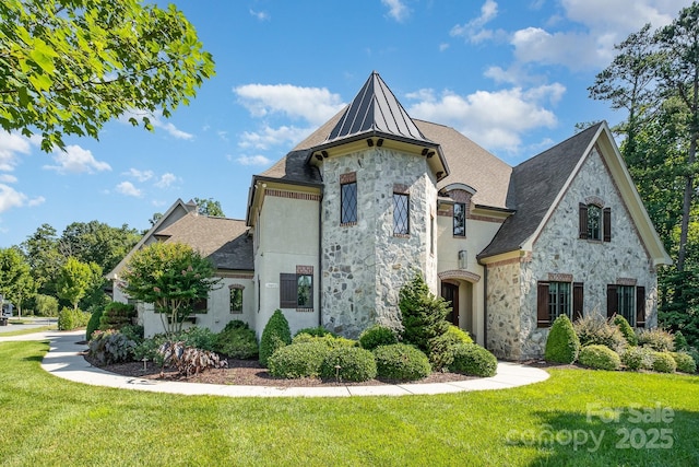 15603 June Washam Rd, Davidson, NC 28036 - french country style house with stone siding, a front yard, and a shingled roof