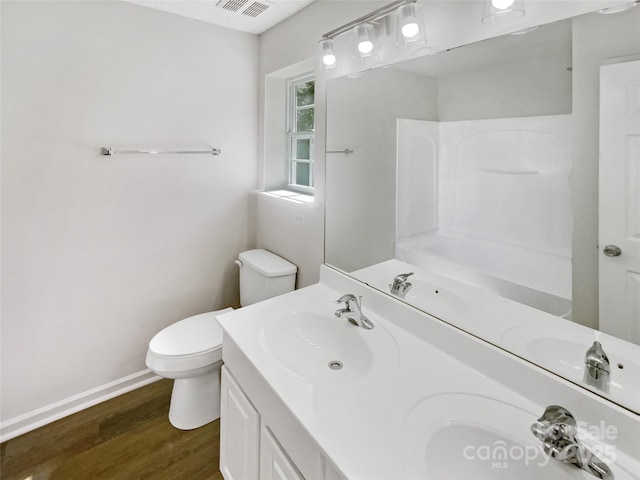 5163 Ficus Tree Ln, Charlotte, NC 28215 - full bathroom featuring wood finished floors and double vanity