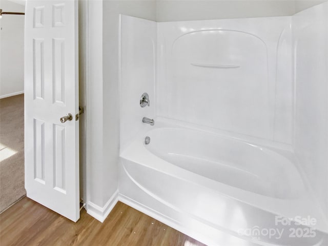 5163 Ficus Tree Ln, Charlotte, NC 28215 - full bath featuring wood finished floors and washtub / shower combination