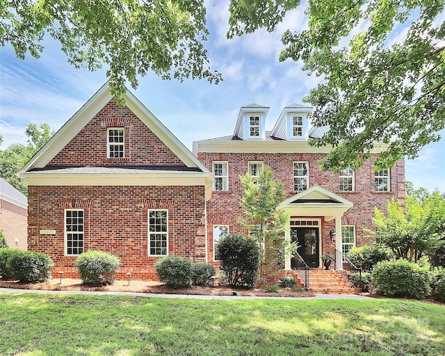 13824 Glen Abbey Dr, Charlotte, NC 28278 - colonial inspired home with a front lawn and brick siding