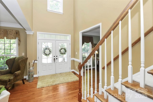 13824 Glen Abbey Dr, Charlotte, NC 28278 - foyer entrance with plenty of natural light, wood finished floors, stairway, and a high ceiling