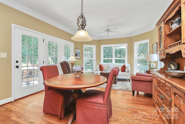 13824 Glen Abbey Dr, Charlotte, NC 28278 - dining space with light wood-style flooring, crown molding, and ceiling fan