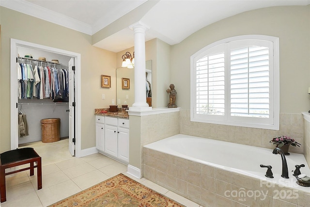 13824 Glen Abbey Dr, Charlotte, NC 28278 - full bath with ornate columns, vanity, a garden tub, and tile patterned flooring