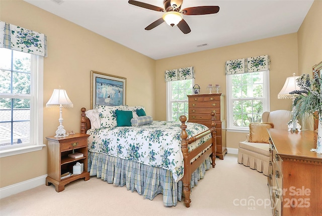 13824 Glen Abbey Dr, Charlotte, NC 28278 - carpeted bedroom with multiple windows and a ceiling fan