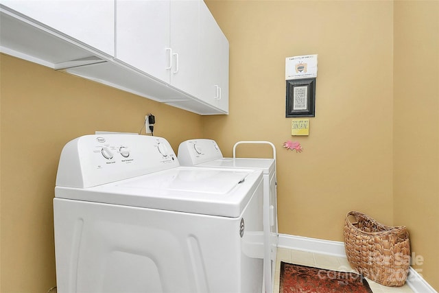 13824 Glen Abbey Dr, Charlotte, NC 28278 - laundry room featuring washing machine and dryer, cabinet space, and tile patterned flooring