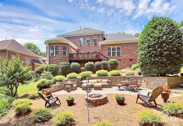 13824 Glen Abbey Dr, Charlotte, NC 28278 - rear view of property with an outdoor living space with a fire pit, a patio, brick siding, and a wooden deck