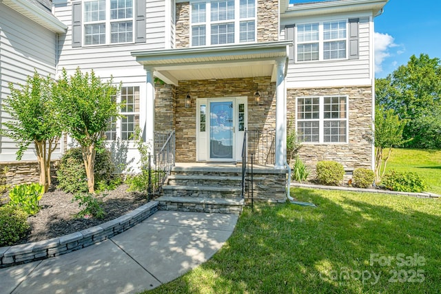 7737 Pleasant Valley Dr, Harrisburg, NC 28075 - doorway to property featuring stone siding and a lawn
