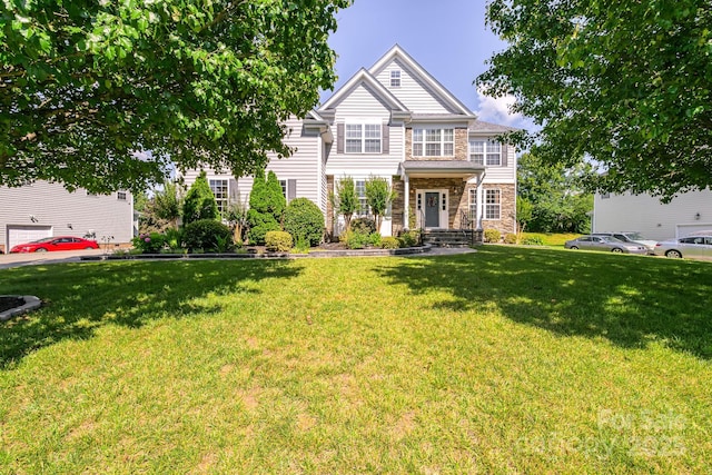 7737 Pleasant Valley Dr, Harrisburg, NC 28075 - view of front of property featuring stone siding and a front lawn