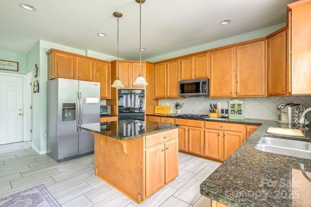 7737 Pleasant Valley Dr, Harrisburg, NC 28075 - kitchen featuring stainless steel appliances, a center island, backsplash, dark stone counters, and pendant lighting