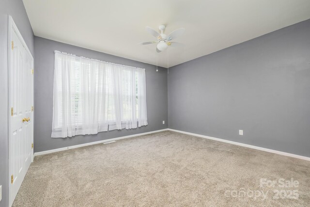 7737 Pleasant Valley Dr, Harrisburg, NC 28075 - empty room with carpet floors and a ceiling fan